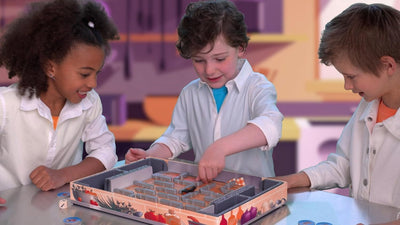 Three children playing Ravensburger Bugs in the Kitchen board game